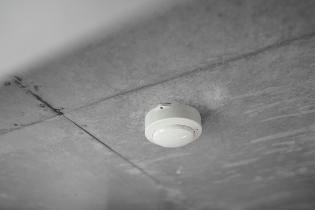 Smoke detector installed on ceiling during Arvada rental inspection